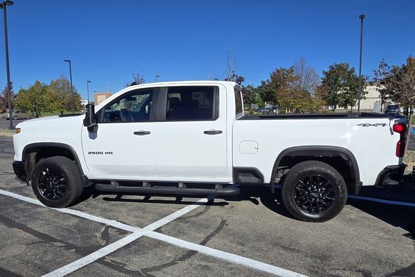 Arch City Property Care's white Chevrolet Silverado 2500HD pickup